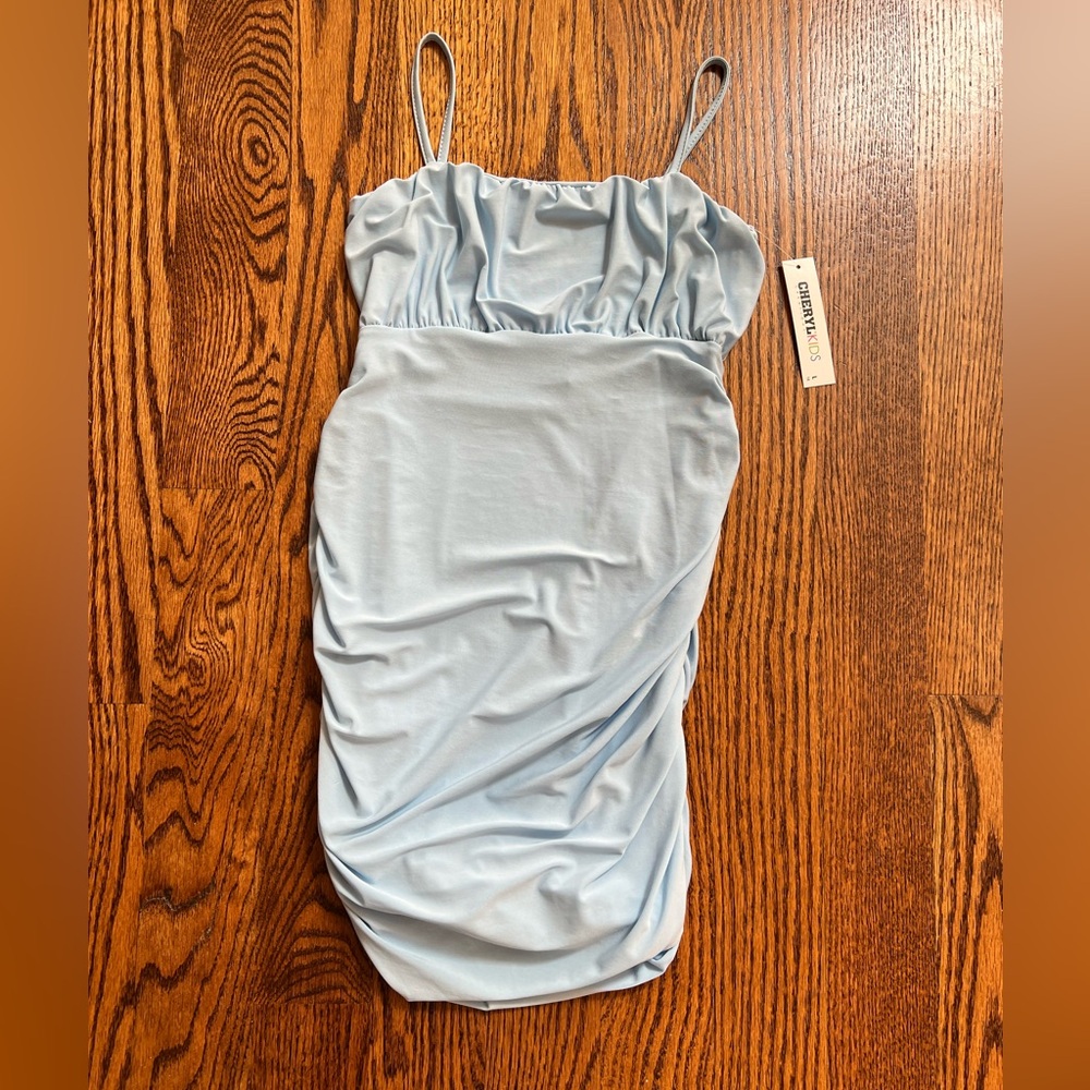 Girls light blue Lycra mini dress. Size Large/14. New with tags
